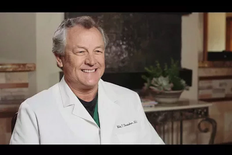 dr thrasher smiling discussing