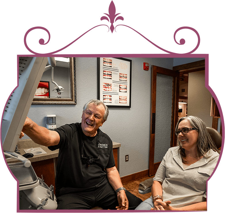 Doctor consulting with patient going over dental x-ray