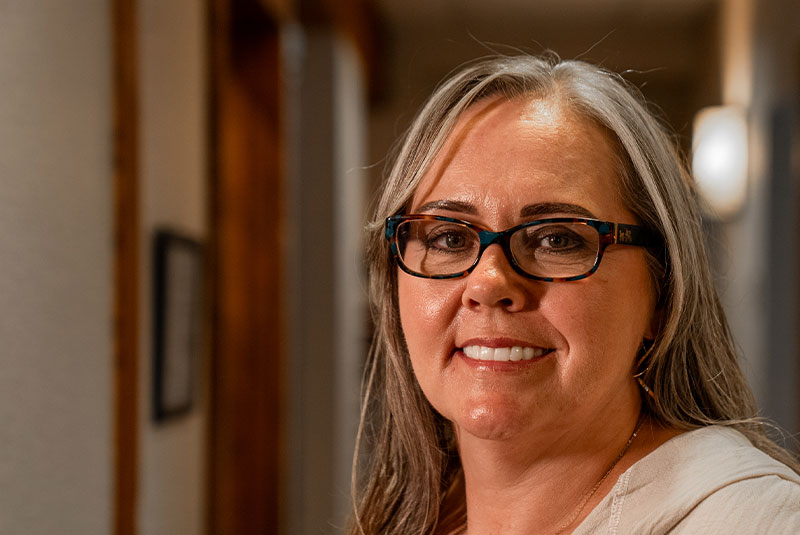Paitent Smiling after full mouth dental implants procedure