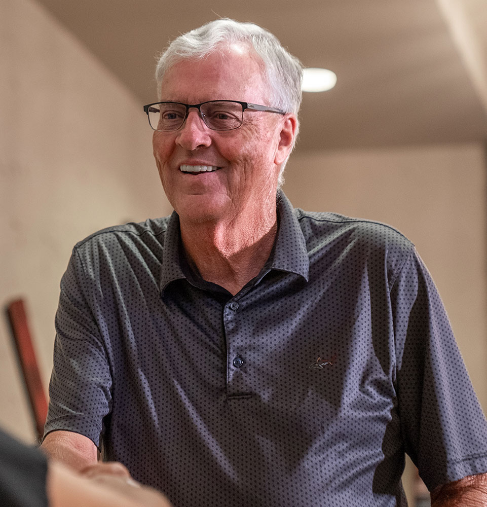 man with collared shirt smiling full arch
