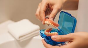 Dentures being stored in a clean, hygienic container for overnight care